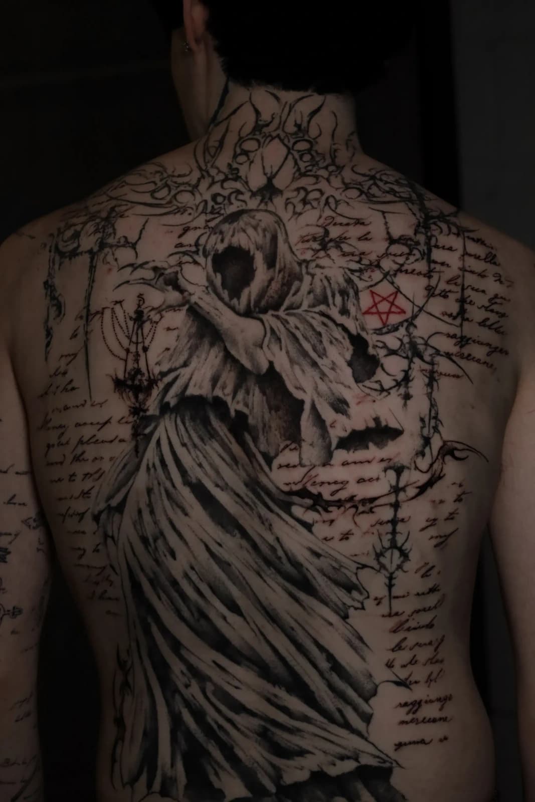 Detailed back piece tattoo